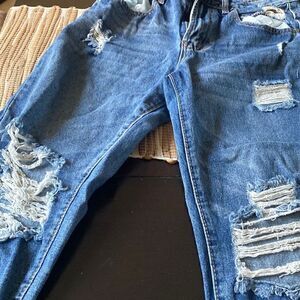 EUC almost Famous jeans size 5 distressed with frayed bottom